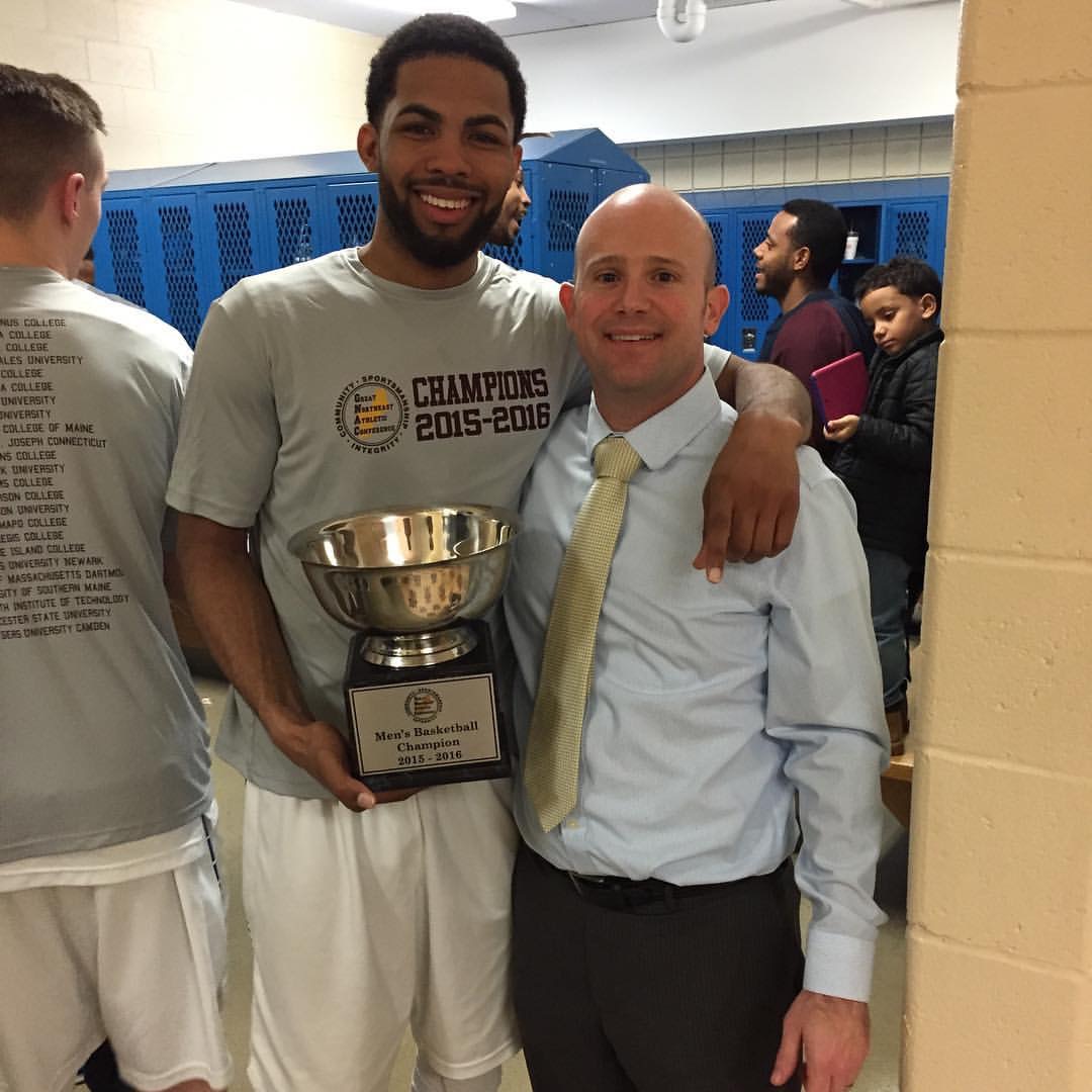 Smoose and sports information intern Tom Garrick after the basketball team won the GNAC Championship.